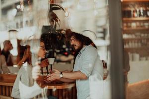 business couple sits in a cafe after a weekday photo