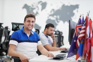 two male software developers working on computer photo