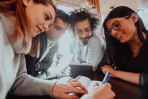 a crazy portrait of a group of entrepreneurs sitting in a modern office. photo