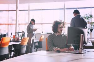 businessman working using a computer in startup office photo