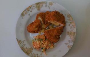 This is home cooking, Chicken Cordon bleu or schnitzel cordon bleu is a dish of chicken meat wrapped in cheese, then breaded and fried. photo