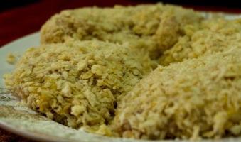 Chicken coated with breadcrumbs is ready to be fried,. photo