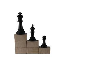 Chess pieces' from wooden cubes show the concepts of reality. Business concept photo