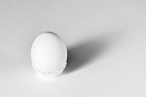 White egg on a white isolated background with shadow. Ingredient.Healthy food.Easter. photo