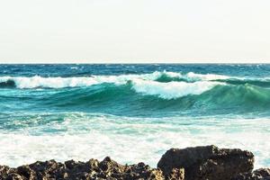 The coast of the Mediterranean Sea. The waves. The horizon. Sky and sea in summer photo