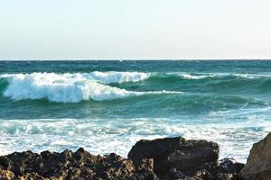 The coast of the Mediterranean Sea. The waves. The horizon. Sky and sea in summer photo