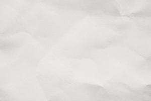 Abstract white crumpled paper texture background photo