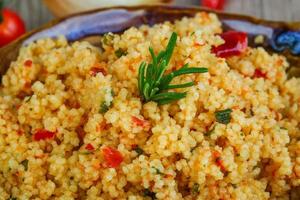 Couscous in a bowl close up view photo