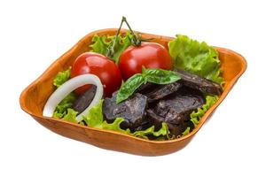 Horsemeat sausage in a bowl on white background photo