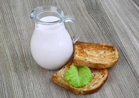 Yogurt on wooden board and wooden background photo