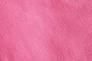 Pink cotton fabric texture closeup background photo