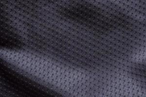 fondo de textura de camiseta de fútbol de ropa deportiva de tela negra foto