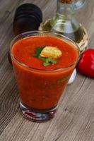 Gazpacho on wooden background photo