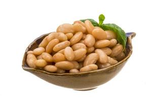 Tinned bean in a bowl on white background photo