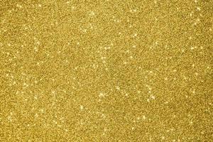 Abstract gold glitter sparkle background photo