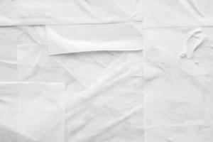 white crumpled and creased paper poster texture background photo