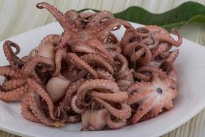 Boiled octopus on the plate photo