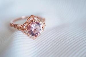 Jewelry luxury pink gold sapphire gemstone ring background photo