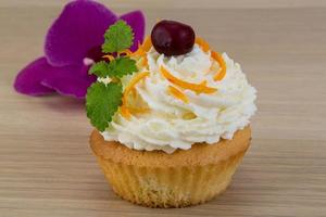 Cupcake on wooden background photo