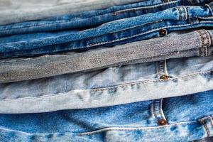 denim blue jeans stack texture background closeup photo