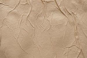 Crumpled brown recycle tissue paper texture abstract background photo