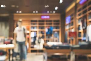 Abstract blur clothing store in modern shopping mall defocused background photo