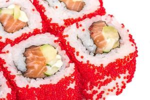 Tobiko Spicy Maki Sushi Hot Roll with various type of flying fish roe outside. Salmon, avocado and Green Lettuce inside photo