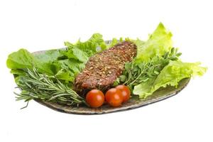 Smoked beef on the plate and white background photo