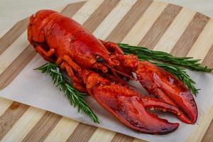 Lobster on wooden board and wooden background photo