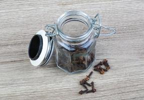 Cloves seeds on wooden background photo