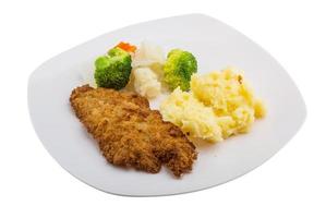 schnitzel on the plate and white background photo