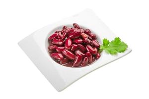 Marinated bean in a bowl on white background photo