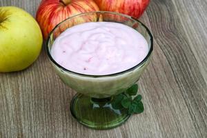 Srawberry yoghurt in a bowl on wooden background photo