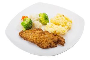 schnitzel on the plate and white background photo