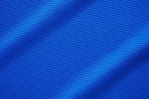 Blue football jersey clothing fabric texture sports wear background, close up top view photo