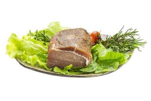 Smoked beef on the plate and white background photo