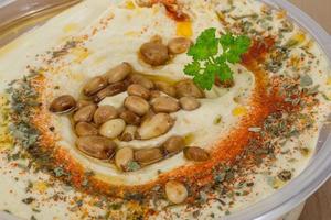 Hummus in a bowl close up view photo