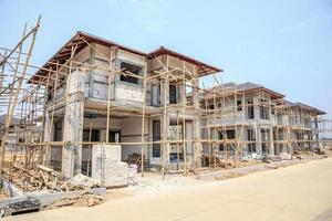 house under construction with autoclaved aerated concrete block structure at building site photo