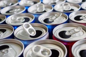 Empty aluminium drink cans recycling background concept photo