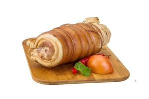 Bacon on wooden board and white background photo