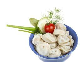 Bowl with traditional russian dish - pelmeni photo