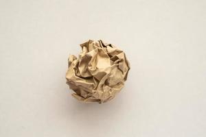 Crumpled recycle brown paper ball photo