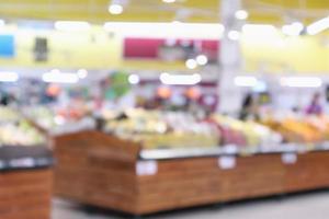 abstract blur organic fresh fruits and vegetable on grocery shelves in supermarket store defocused bokeh light background photo