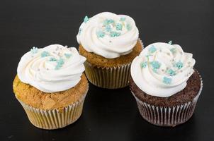 Cupcakes on wooden background photo