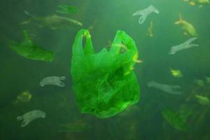 Plastic bag pollution underwater ocean background photo