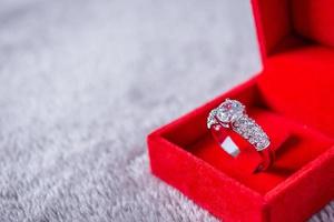 engagement wedding diamond ring in red jewelry gift box photo