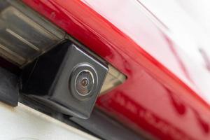 Red car rear view camera close up for parking assistance photo