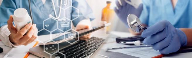 Medicine doctor hand working on a patients x-ray scans digital healthcare and connection with modern virtual screen interface icons, Medical technology and network concept. photo