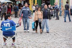 BUENOS AIRES, ARGENTINA - MAY, 9 2015 - Maradona lookalike at la boca painted house in Buenos Aires photo