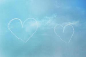 The trace of the plane in the sky in the shape of a heart. photo